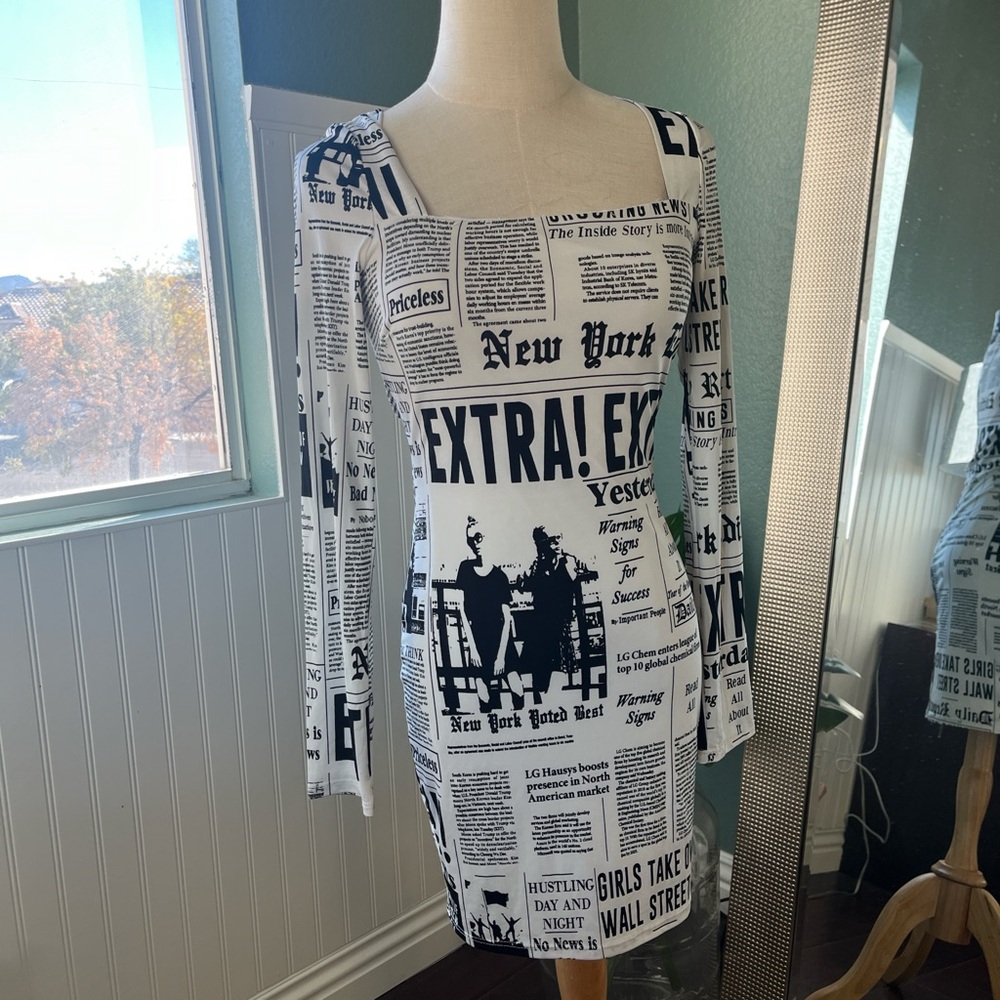 Longsleeve newspaper dress pre owned excellent condition.